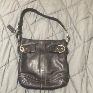 Black natural cowhide leather coach purse.